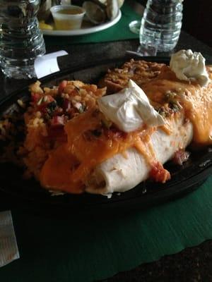 Daily special - chicken burrito with refried beans and rice.