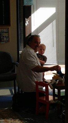 Dr. DeCarlo with one of our tiny patients playing with legos in our kids corner!