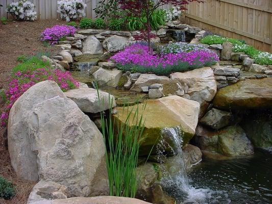 Giant boulders make all the difference in the world when building a magnificent pond. If you have a 7' access through your gate