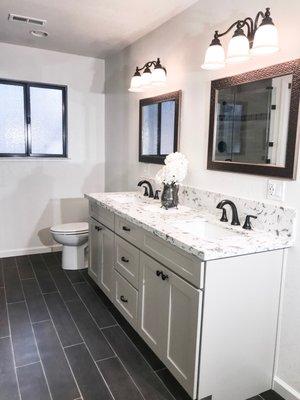 This lovely remodel was a huge improvement to the previously small and outdated 80's style bathroom!