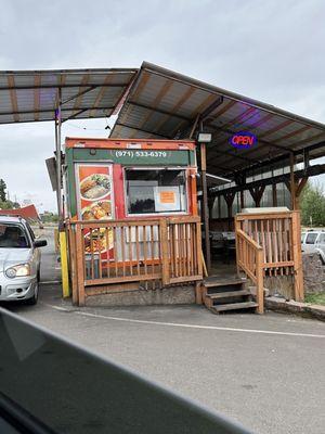 Drive through and deck porch area to sit