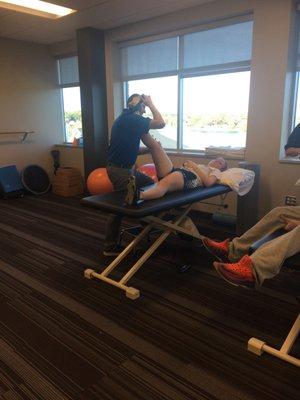 Cathy stretching after a tough workout! She is so strong.