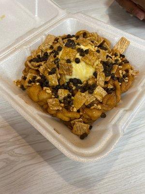 8'' funnel cake with butterscotch Cinnamon Toast Crunch chocolate chips cinnamon sugar and ice cream.