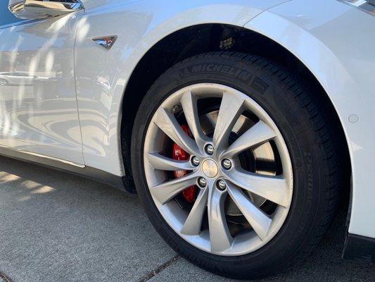 Tesla decal with red calipers