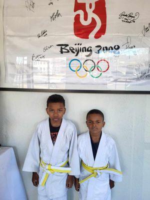 After promotions and receiving their new belts. They were exhausted and are much happier than they look.