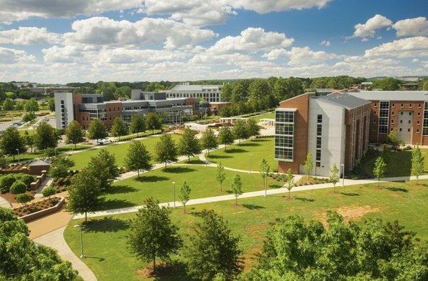 Campus Greenway with a view of the Student Services Center and Charger Village