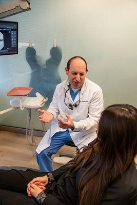 Dr. Sider educating a patient on Primescan