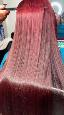 Beautiful hair color transformation: from dark brown to burgundy.