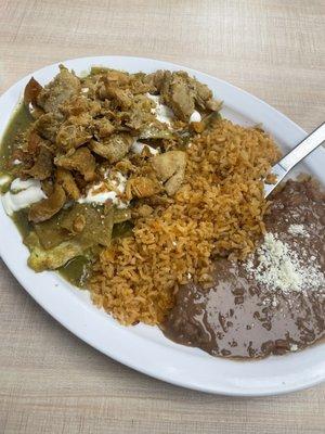 Green chilaquiles plate with chicken and egg