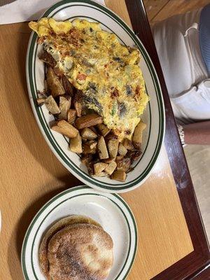 Veggie omelet with spinach & swiss. Home fries. Grilled english muffin. Very good.