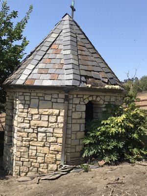 Slate roof repair on chapel infested with bees