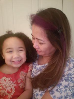 My princess showing off her new earrings to grandma.