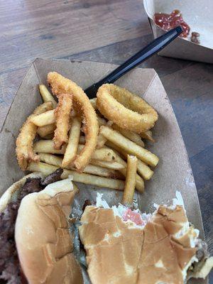 1/2 grandson's burger, my 1/2 eaten burger, fries and onion rings