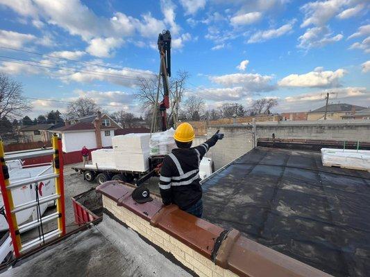 Roofing materials delivered to a job