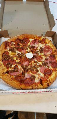 Sausage, Canadian bacon, and pepperoni pizza