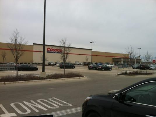 Facing the store from the gas pumps.