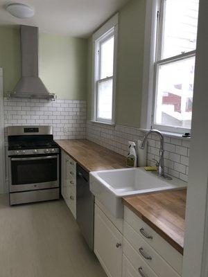 New Kitchen. Hood fan installed. Went with wood countertops and Ikea cabinets and Ikea sink! Totally awesome for us.