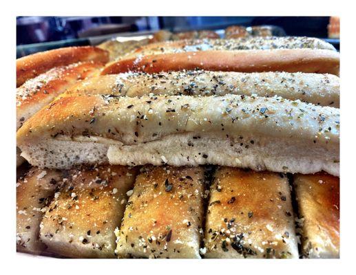 Garlic Parmesan Breadsticks @ Bacci Pizzeria Chicago, IL ( Corner Milwaukee & Montrose ) Dine In TakeOut Delivery. Jumbo Slice Pizza! Cool!