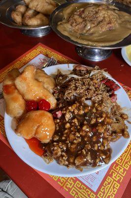 My plate of Sweet and sour chicken, subgum pork fried rice, and lobster sauce from individual entrees. Egg Foo Yong in the background.