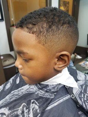 Kids mid bald fade.