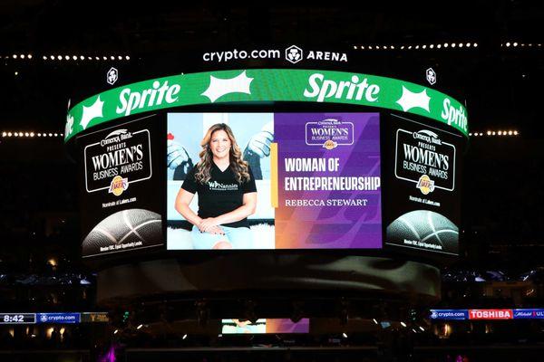 Our CEO, Rebecca receiving the Woman of Entrepreneurship award at the Los Angeles Lakers game.