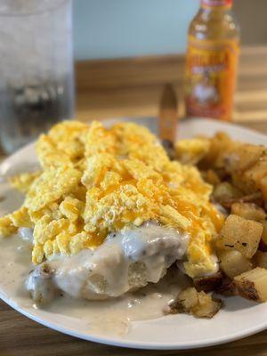 Chicken fried steak over biscuit covered in gravy and egg.