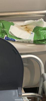 Soiled wipes in on top of the clean ones in the package on top of the toilet