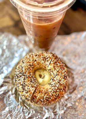 Sausage egg and cheese on an everything bagel With a large iced coffee