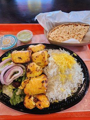 Joojeh (chicken breast) kabob, rice, salad, and naan.