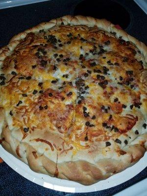 My 5 meat stuffed pizza! Yes I know those little dark spots look like rabbit turds but it's small pieces of ground beef.