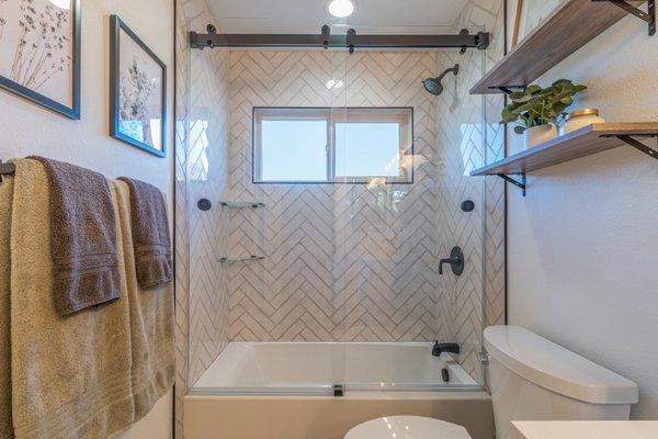 Frameless Dual Slider Shower Door over Tub. This is our double door barn door slider that features Starfire Ultra Clear Glass