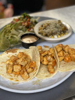 Grilled Mahi Mahi tacos with a side of roasted street corn