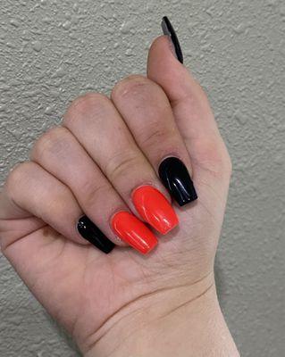 Halloween nails. Neon orange and black gel on acrylic nails