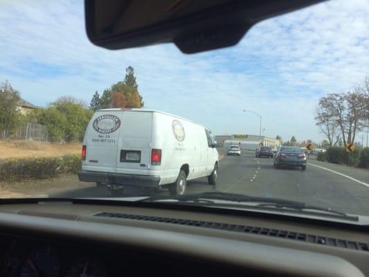 Van that employee was texting with Two hands while driving on 12/31/13 on Alta Arden just before noon.