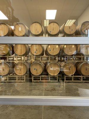 Barrels of wine you can see from tasting room.