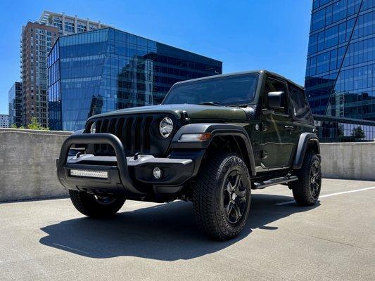 My new Jeep after adding a top, bull bar, and side steps.