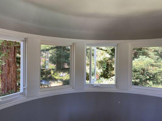 Interior finish of wood windows in a rounded wall.