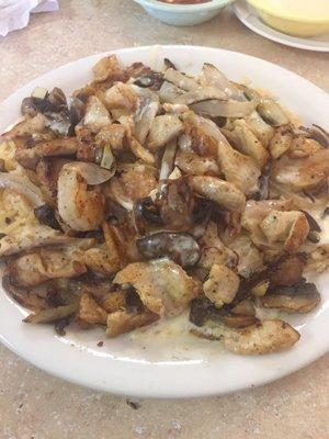 House special with chicken, shrimp, mushrooms, onions, queso and rice