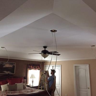 A master bedroom ceiling in the process of getting recessed LED lighting