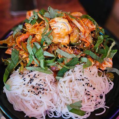 Freshwater snail salad with cabbage, basil, zucchini, and vermicelli with sweet & spicy sauce