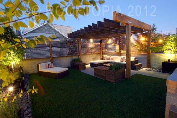 Modern Garage rooftop in Wicker Park. Custom pergola, benches/planters and screens with lighting and a sound system.