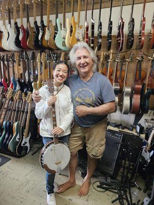 Owner, Alex, with happy customer looking for a banjo.  Photo taken and posted with permission.