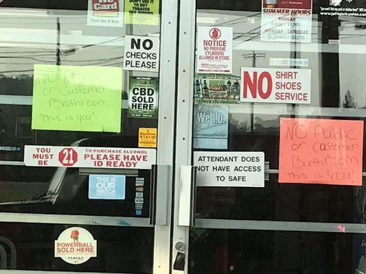 Signs on door say "No public or customer bathroom. This is you!"