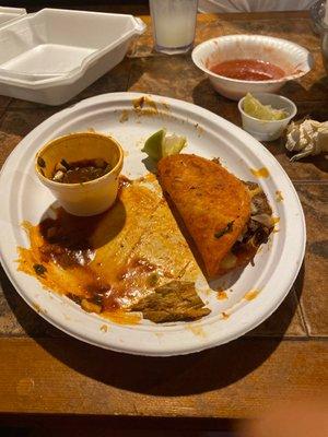 Birria tacos and consome