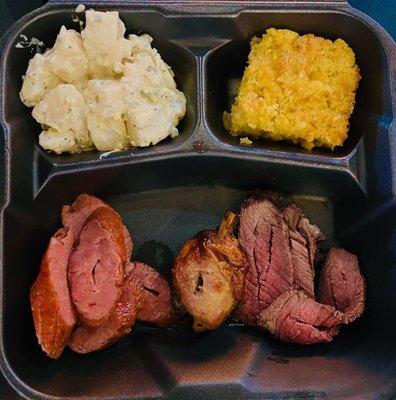 mixed grill trio sausage, chicken, sirloin, potato salad, and cornbread