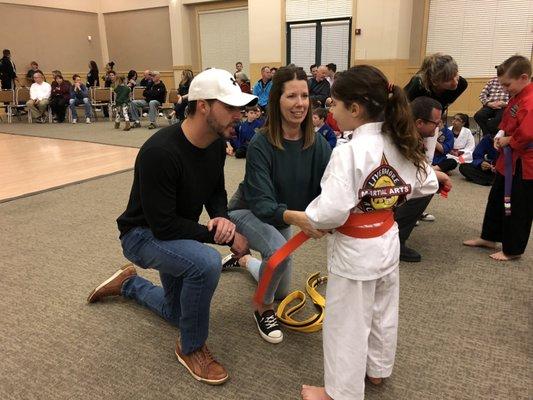 Parents celebrating belt promotions