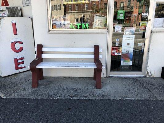 Bench for customers and weary travelers.