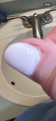 Hurt nail cut with unsanitary cuticle cutter when told It was painful.