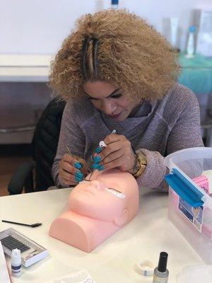 Student practicing eyelash extension