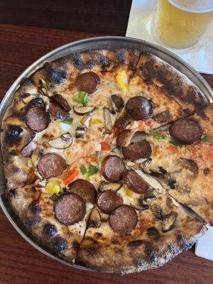 Southy pizza featuring Tallahassee-based Bradley's sausage. Paired with a Suds Light Lager.